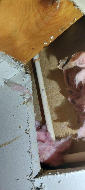 Responded to emergency call for clogged drain causing water intrusion into living room. Located blockage in exterior drain line, which required accessing wall cavity with exposed insulation to inspect interior piping, then clearing obstruction via exterior spigot access point. Successfully restored proper drainage and verified no further water intrusion into the property.