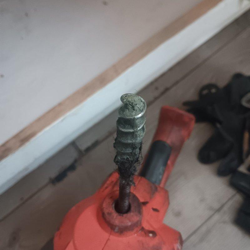 Responded to service call for kitchen drain backup. Inspection revealed significant corrosion on metal fittings connecting to the P-trap assembly, with visible mineral deposits and deterioration of connecting valve. Removed affected components, cleaned accumulated debris from P-trap, and replaced corroded metal fittings with new parts to restore proper drainage function.