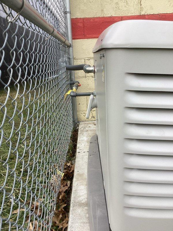 Installed approximately 60 feet of 1-1/4" gas piping to connect the building's Generac standby generator. Piping was routed along the exterior of the building, properly secured to the concrete block wall, and connected to existing gas service. System was pressure tested and verified for proper operation.
