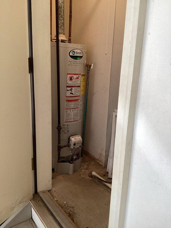 Performed diagnostic assessment on A.O. Smith 50-gallon water heater located in utility closet. Evaluated unit condition, connections, and control valve system to determine replacement requirements. Provided customer with replacement options and estimate as requested.