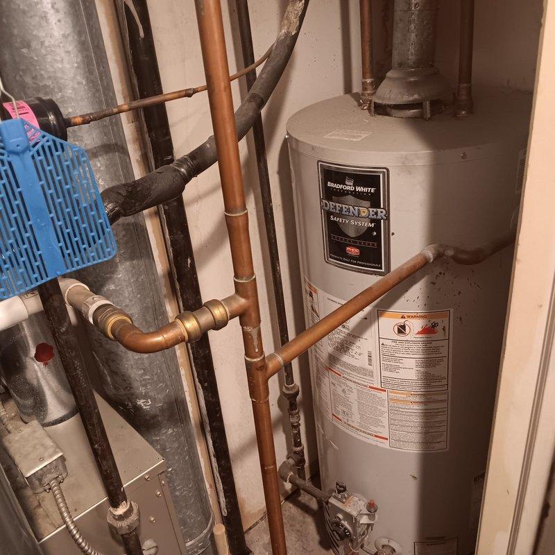 Inspected main water valve at condo unit and identified significant water damage on wall adjacent to water heater, likely from valve leakage. Repaired defective main valve to restore proper functionality and examined bathroom tub diverter/spout, completing necessary repairs to resolve water flow issues.