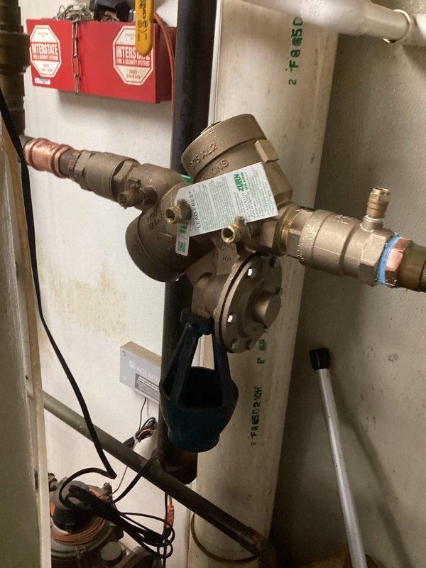 Removed and disposed of old backflow device and installed new 1 1/2" Wilkins 975 XL backflow preventer in mechanical room. Performed required testing of the newly installed device to confirm proper operation and compliance with regulations.