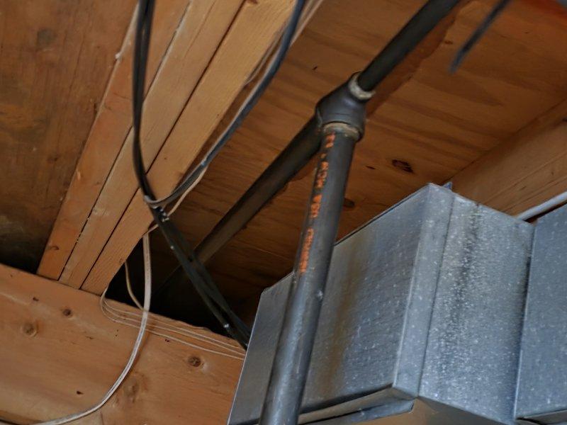 Installed approximately 15 feet of black iron gas pipe through exposed ceiling joists, connecting from the exterior gas meter to the interior service point. Properly secured pipe to structural elements and verified all connections were leak-free. Ensured installation complies with local gas code requirements.