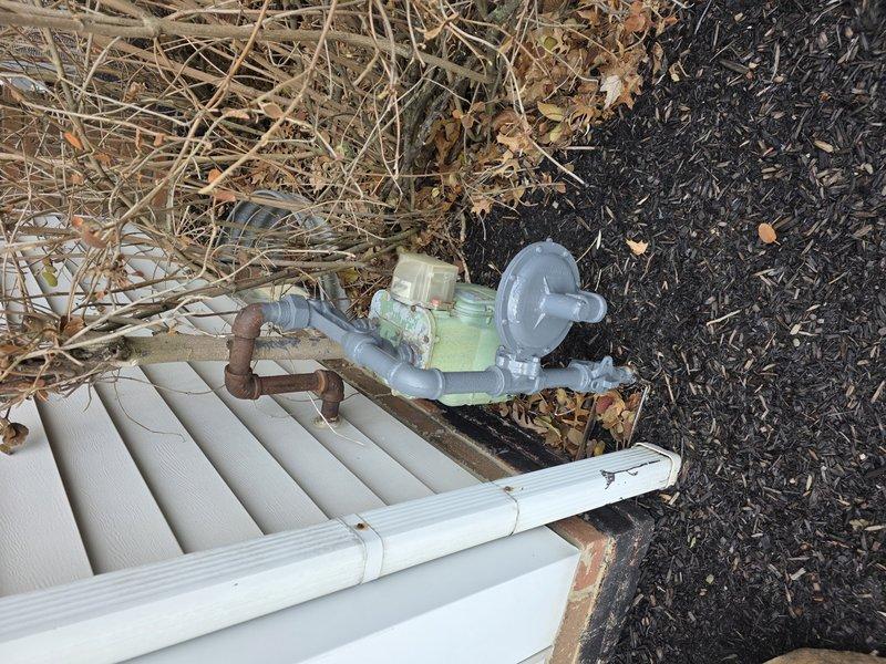 Installed approximately 15 feet of black iron gas pipe through exposed ceiling joists, connecting from the exterior gas meter to the interior service point. Properly secured pipe to structural elements and verified all connections were leak-free. Ensured installation complies with local gas code requirements.