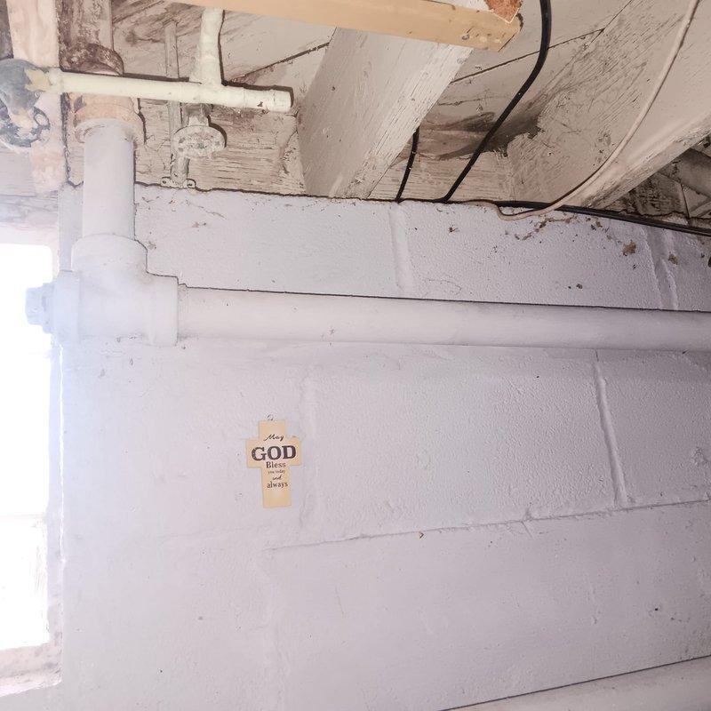 Responded to a service call for a clogged sink at a residential property built in 1951. Upon inspection, found significant blockage in the P-trap system under the sink causing drainage failure. Successfully cleared the obstruction, cleaned the affected PVC drain components, and verified proper water flow restoration through the plumbing system.