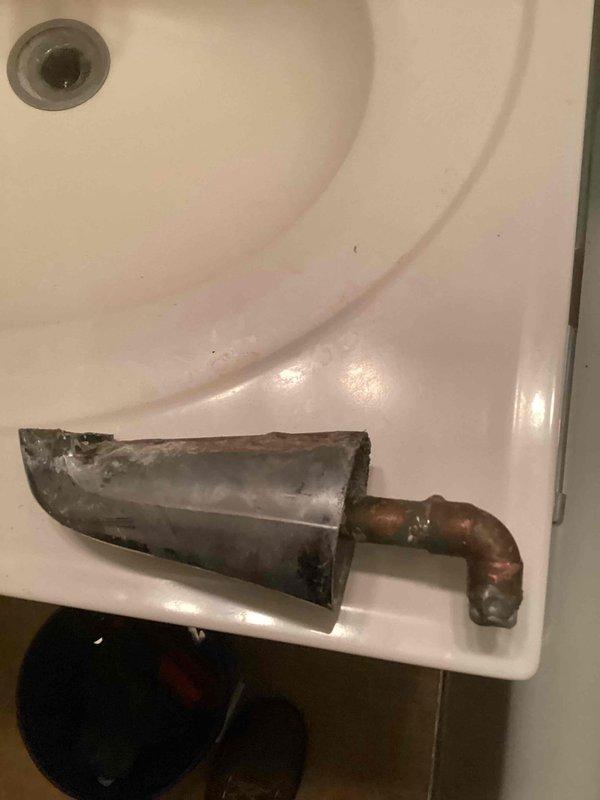 Responded to a callback regarding persistent faucet leakage around drain area. Upon inspection, discovered heavy corrosion and mineral buildup on the faucet components. Removed and replaced the affected hardware to resolve the ongoing leak issue.