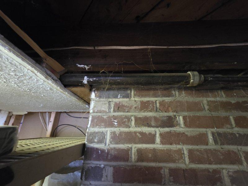 Completed installation of approximately 20 feet of 1-1/4" gas line in interior basement area. Line was properly secured with metal brackets to ceiling joists and connected to existing system. Inspected all connections for leaks and confirmed proper operation of the gas piping system.