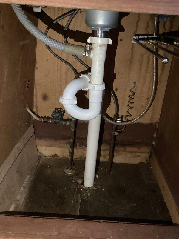 Completed kitchen drain line replumb from reducer to vent, reconnecting to main kitchen drain line. Installed new P-trap and replaced all piping to the tailpiece, ensuring proper drainage and venting compliance. Visual inspection confirmed successful installation with all connections secure and functional.