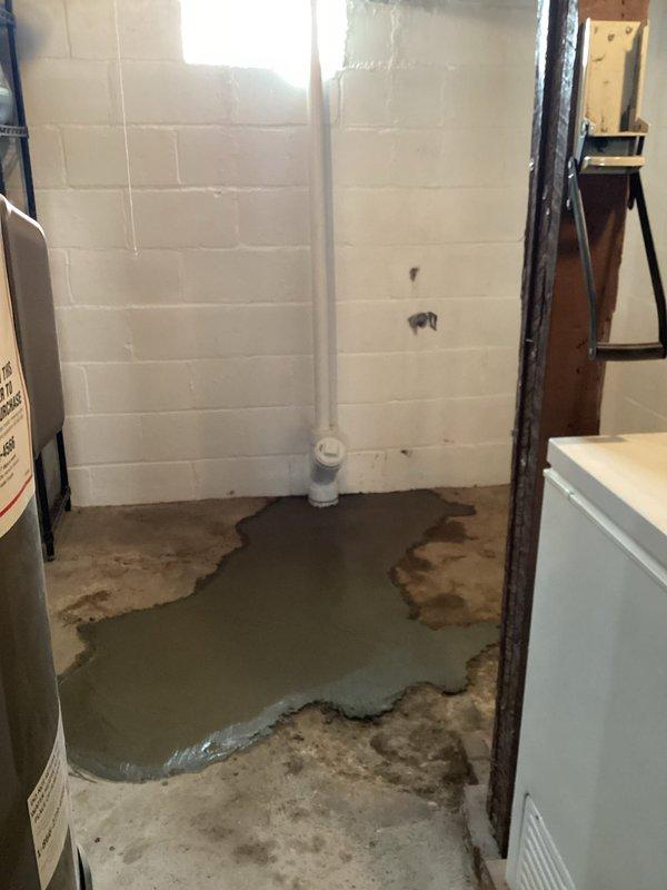Successfully completed replacement of deteriorated underground 4-inch cast iron drain pipe with new 4-inch PVC, connecting to the existing PVC main line. Replumbed kitchen sink drain with 1½-inch PVC piping to ensure proper drainage and prevent basement water accumulation. Completed concrete floor restoration after pipe installation, with all debris and materials properly removed from the premises.