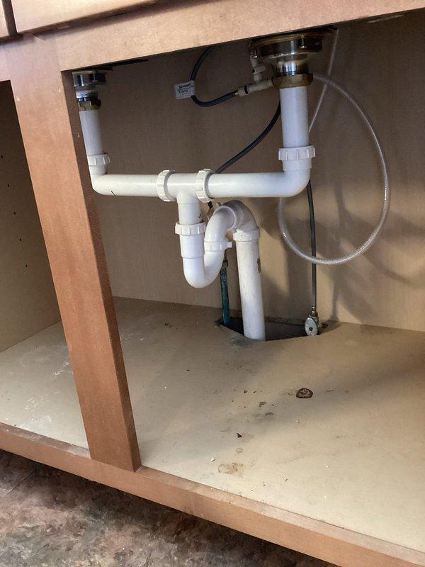 Successfully completed replacement of deteriorated underground 4-inch cast iron drain pipe with new 4-inch PVC, connecting to the existing PVC main line. Replumbed kitchen sink drain with 1½-inch PVC piping to ensure proper drainage and prevent basement water accumulation. Completed concrete floor restoration after pipe installation, with all debris and materials properly removed from the premises.