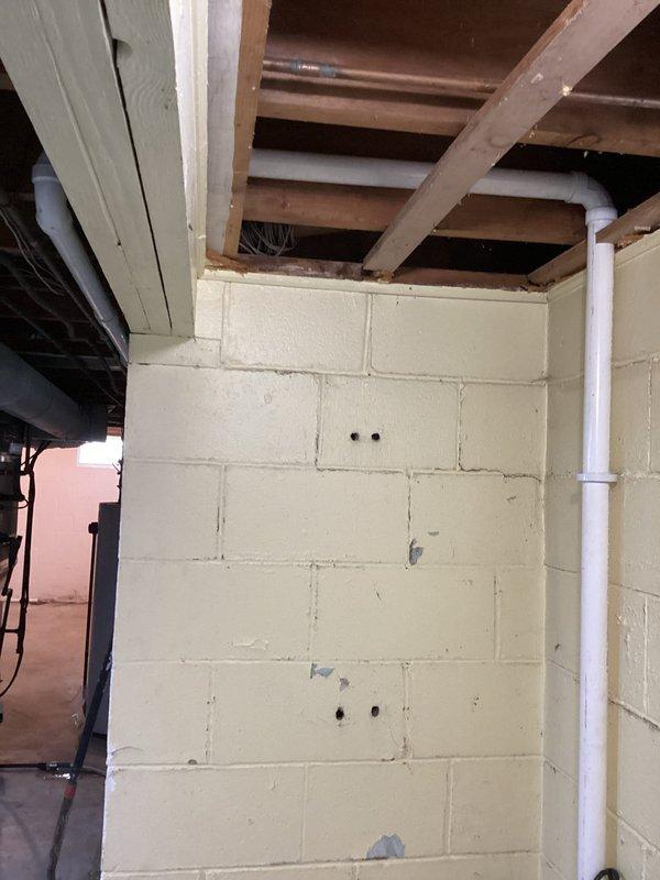 Completed basement shower removal with proper water line capping. Installed new sump pump system including concrete removal/replacement, footer drain redirection from floor drain to sump crock, floor drain riser repair, and installation of dedicated electrical outlet. Constructed 1½" PVC discharge line connecting to existing 4" PVC downspout drain with all debris removed from premises.