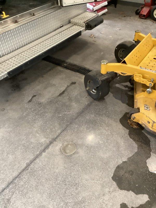 Provided comprehensive estimate for commercial sewer line cleaning services covering six long trench drains at Station 3. Assessment included inspection of linear floor drainage systems with metal grates installed in concrete flooring, evaluation of debris accumulation within drain openings, and determination of equipment requirements including specialized wheeled drain cleaning machinery positioned on-site for the proposed work.