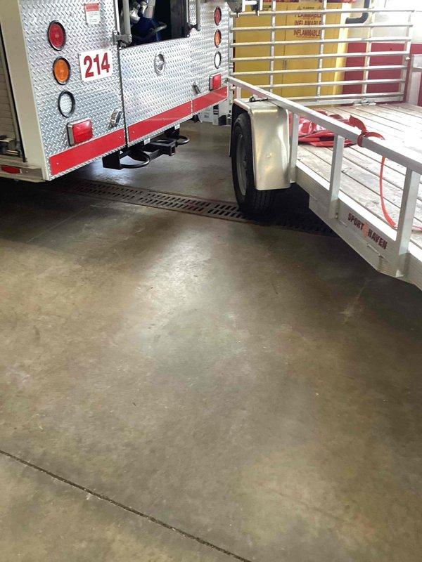 Provided estimate for cleaning six drains at commercial fire station facility, primarily consisting of small floor drains throughout the apparatus bay and storage areas. Assessed drainage system layout and documented existing conditions with photographs to determine scope of work and equipment requirements for drain cleaning services.