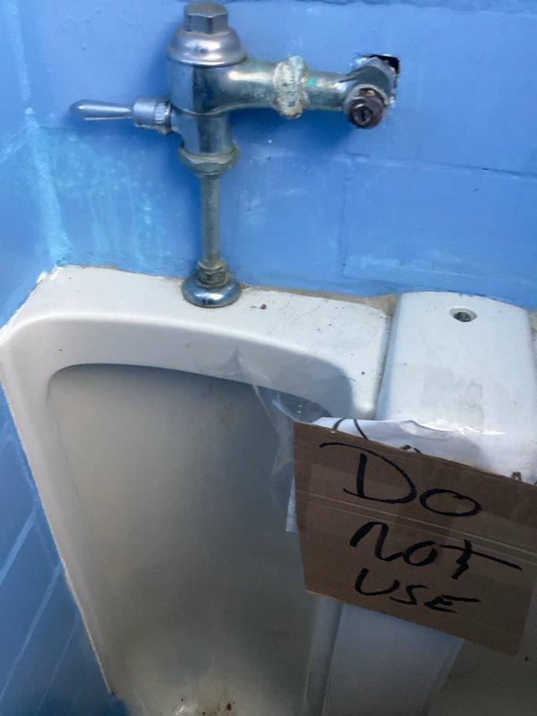 Responded to service call for assessment of broken and leaky pipes affecting multiple areas of the property. Conducted comprehensive inspection of two basement bathrooms and additional accessible areas to evaluate plumbing system integrity. Documented extensive water damage to ceiling with visible deterioration, staining, and structural compromise indicating active or recent pipe leak above the affected area. Inspected non-functional toilet with corroded flush valve assembly and supply connections showing mineral buildup and component failure. Unit tagged out of service due to mechanical failure requiring repair or replacement. Provided detailed photographic documentation of all damaged areas and compiled repair estimates for necessary plumbing corrections including pipe repairs, fixture replacement, and water damage remediation.