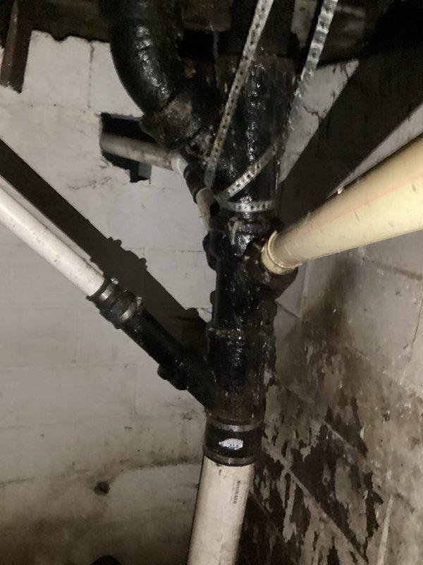 Completed comprehensive plumbing inspection focusing on second floor bathroom drainage system. Inspection revealed deteriorated bathroom stack requiring replacement, with visible corrosion and heavy buildup on existing cast iron piping at junction points. Documented conditions of drain stack connections, supporting infrastructure, and surrounding areas showing moisture damage and age-related deterioration that necessitate full stack replacement to restore proper drainage function and prevent future leaks.