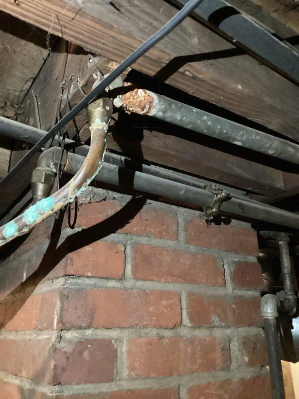 Conducted on-site assessment of residential water supply system experiencing significantly reduced water pressure throughout the property. Upon inspection, identified severely corroded and deteriorated copper water lines in the basement area, with visible oxidation, rust buildup, and compromised pipe integrity. The existing piping infrastructure showed extensive age-related wear, with corroded connections and fittings that were contributing to the pressure loss. Documented the condition of the water distribution system, including the main supply lines, shutoff valves, and pressure gauge assembly. Provided comprehensive estimate for complete replacement of interior water supply piping to restore proper water pressure and system functionality.