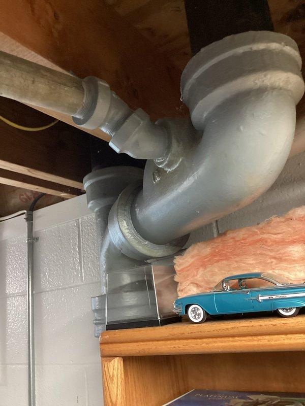 Responded to main drain blockage with complete stoppage. Upon arrival, accessed main drain cleanout in basement utility area and successfully cleared obstruction using appropriate drain cleaning equipment. Verified proper drainage flow restored throughout system and confirmed all fixtures draining normally upon completion.