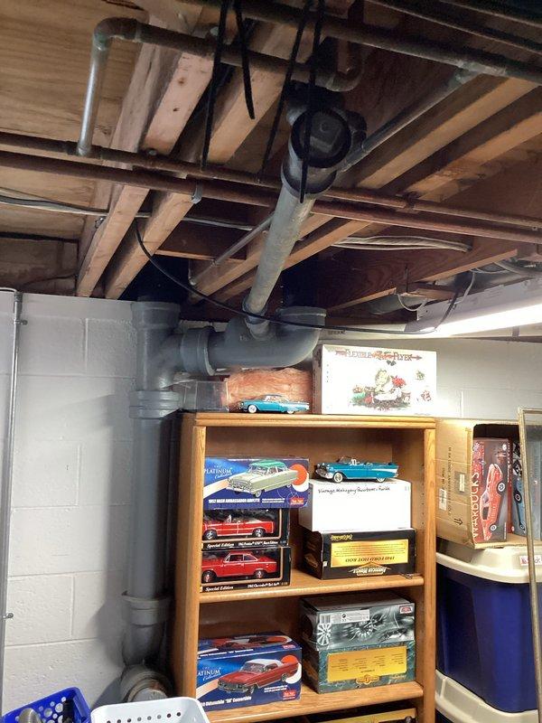 Responded to main drain blockage with complete stoppage. Upon arrival, accessed main drain cleanout in basement utility area and successfully cleared obstruction using appropriate drain cleaning equipment. Verified proper drainage flow restored throughout system and confirmed all fixtures draining normally upon completion.