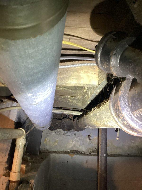 Completed drain unclogging service in basement following initial water removal by previous technician. Cleared obstruction from drainage system and verified proper flow through plumbing lines. Inspected basement utility area including PVC drainage pipes, copper supply lines, and associated mechanical systems to ensure full restoration of drainage function.