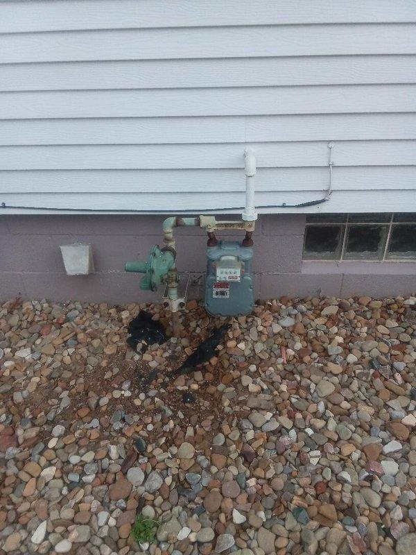 Installed approximately 25 feet of interior gas piping to extend service from the exterior meter assembly to the basement utility area. Routed new gas line through basement ceiling joists using appropriate hangers and supports, terminating near laundry and mechanical equipment location. All connections were pressure tested, inspected for leaks using approved detection methods, and verified to meet code requirements for residential gas installations.