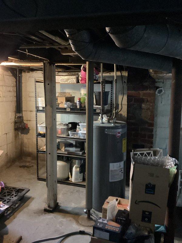 Completed exterior sanitary sewer lateral replacement from house foundation to right of way. Performed camera inspection and locating services to identify existing sewer line running between houses toward front of property. Excavated trench along left side of house, removing section of sidewalk as necessary for access. Installed new SDR 35 solid PVC pipe with appropriate fittings, backfilled with #57 limestone for proper drainage and support. Reconnected new lateral to existing exterior floor drain connection at foundation. Obtained exterior sewer lateral permit and coordinated inspection. All work completed to code specifications with proper bedding and backfill materials.