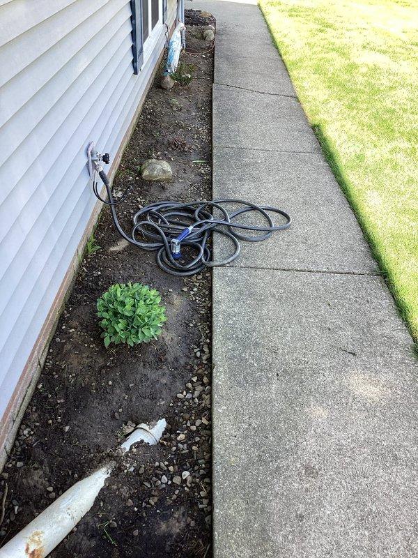 Responded to service call for front gutter assessment due to water overflow issues. Upon arrival, conducted thorough exterior inspection of the property's drainage system and gutter areas along the side of the residence. Documented existing conditions through photographic evidence, capturing the concrete walkway, foundation area, and surrounding landscape features. Evaluated the gutter system's performance and identified potential causes of water overflow. Provided detailed assessment findings and prepared repair recommendations for the homeowner's review and approval.
