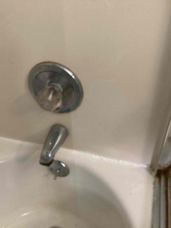 Completed cartridge replacement and shower diverter installation on a Delta single-handle tub/shower faucet in a 75-year-old home. Accessed the wall cavity to expose existing plumbing infrastructure, removed the failed cartridge from the valve body, and installed a new replacement cartridge to restore proper temperature control and water flow. Installed a new shower diverter mechanism to allow switching between tub spout and showerhead functions. Reassembled the trim components, tested all functions for proper operation, and verified no leaks were present at the valve body or connections.