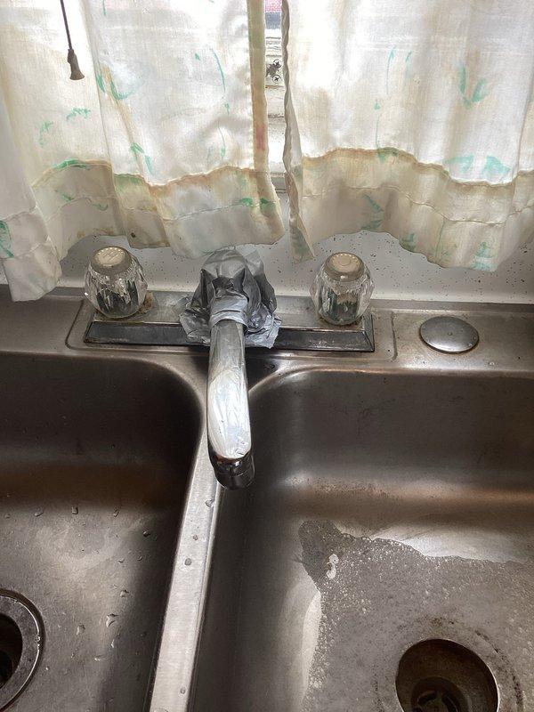 Conducted on-site assessment for kitchen faucet replacement. Evaluated existing chrome two-handle faucet installation on stainless steel double-basin sink, noting significant wear, mineral deposits, and staining on fixtures and basin surfaces. Inspected underlying plumbing connections in basement area, including supply lines, shut-off valves, and drainage components to determine scope of replacement work. Provided comprehensive estimate for complete faucet replacement including removal of existing fixture, installation of new faucet assembly, and verification of all supply line connections.