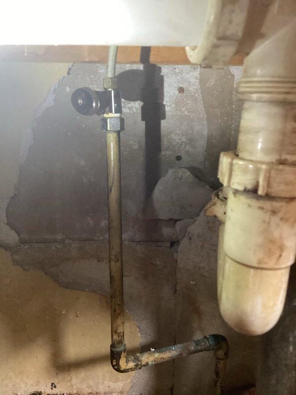 Conducted on-site assessment for kitchen faucet replacement. Evaluated existing chrome two-handle faucet installation on stainless steel double-basin sink, noting significant wear, mineral deposits, and staining on fixtures and basin surfaces. Inspected underlying plumbing connections in basement area, including supply lines, shut-off valves, and drainage components to determine scope of replacement work. Provided comprehensive estimate for complete faucet replacement including removal of existing fixture, installation of new faucet assembly, and verification of all supply line connections.