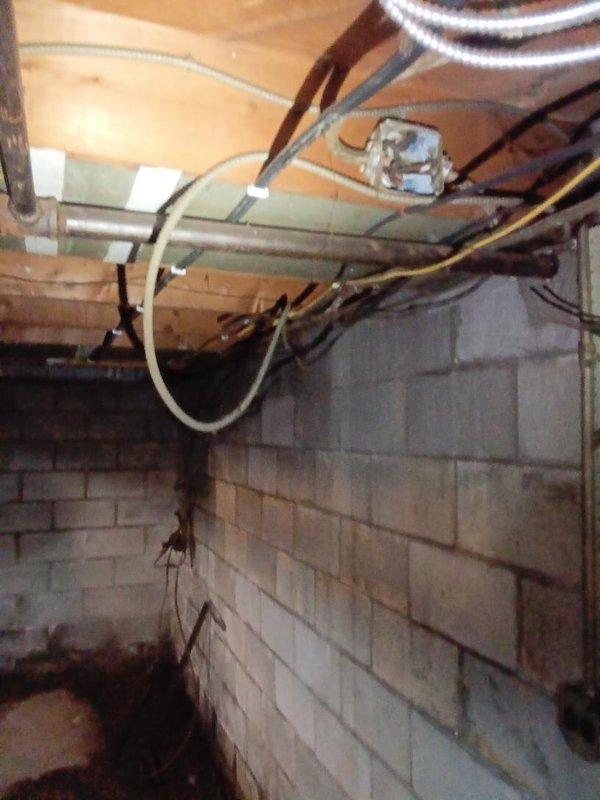 Installed approximately 20 feet of gas piping in the interior basement area, routing the line through the crawl space along existing floor joists and concrete block foundation walls. Work included proper securing of gas line to structural members, ensuring compliance with code requirements for indoor gas installations, and integration with existing mechanical systems in the utility space.