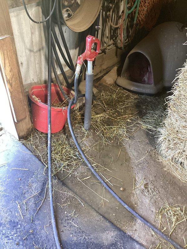 Responded to water leak at hand pump well system previously installed in barn. Upon arrival, found active leak causing flooding in work area with water pooling on concrete floor around pump base. Inspected hand pump assembly and associated plumbing connections for source of leak. Identified compromised seal or fitting connection at pump body. Disassembled affected components, replaced faulty seals and gaskets, and reassembled hand pump system. Tested pump operation to verify proper function and confirmed leak was resolved with no further water discharge. Advised on routine maintenance to prevent future seal deterioration.