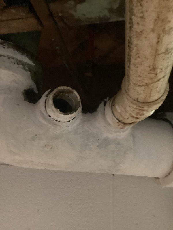 Responded to emergency plumbing call for tenant reporting complete loss of bathroom functionality due to collapsed or disconnected drain stack from bathroom. Accessed utility area and inspected main drain system, including stack connections and cleanout access points. Documented existing conditions of drainage infrastructure and assessed structural integrity of plumbing components to determine extent of repairs needed for restoration of bathroom service.