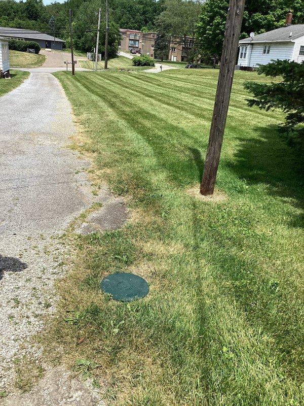 Responded to drain cleaning request at a 70-year-old residential property. Successfully snaked the main drain line from the apartment unit through to the street connection to clear the obstruction. Documented the exterior utility access points and completed the clearing operation to restore proper drainage function.