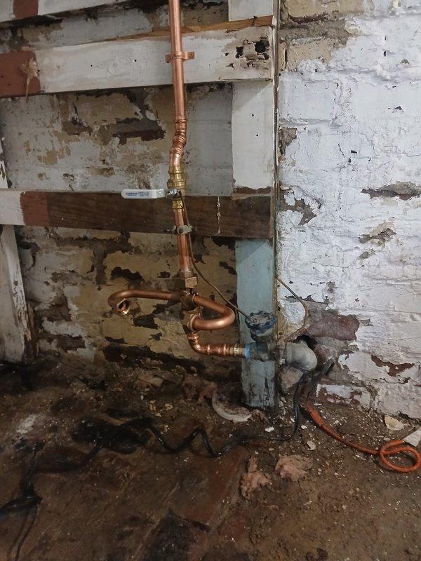 Ordered and awaiting delivery of parts required to install a meter horn assembly for a 5/8" water meter in a basement utility area with aging plumbing infrastructure. Upon arrival of components, will complete the installation of the meter horn to the existing copper pipe system, ensuring proper integration with the water meter and compliance with plumbing code requirements.