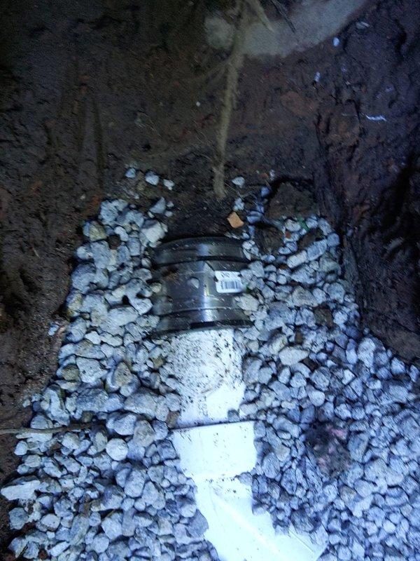 Completed a 10-foot exterior sanitary sewer lateral repair requiring excavation and permit compliance. Removed damaged section of sewer line and installed new white PVC pipe on a properly graded gravel bed for drainage support. Backfilled excavation and coordinated inspection scheduling to ensure all work met local plumbing code requirements.