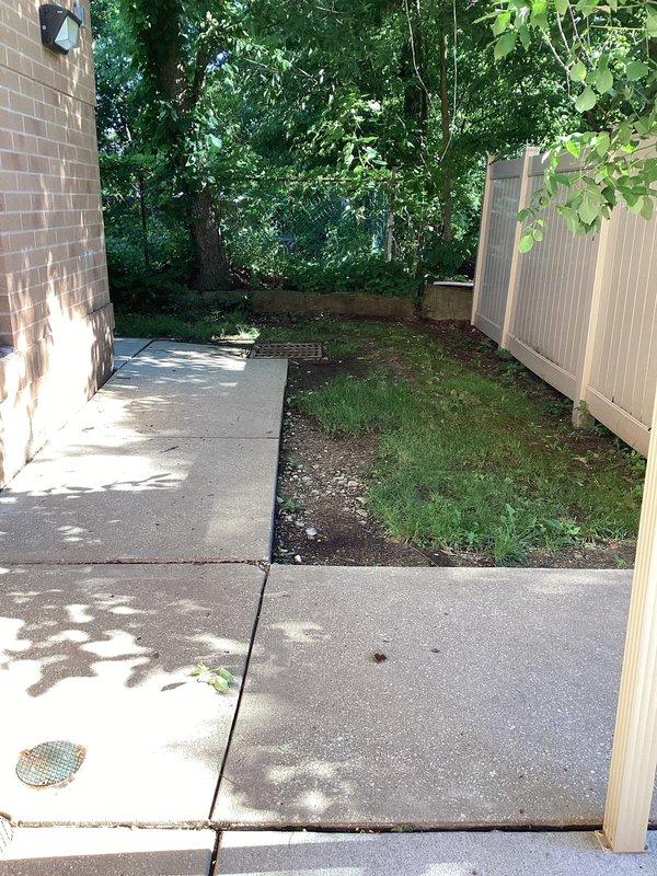 Relocated exterior drain at church front entrance to redirect water flow and prevent building intrusion. The existing drainage system was inadequate, allowing water to pool near the doorway and potentially enter the facility. Assessed the site conditions, including concrete walkway configuration and grade around the entrance area. Excavated and repositioned the drain to a more effective location that captures water runoff before it reaches the building threshold. Completed installation with proper slope and drainage pathway to ensure water is diverted away from the structure, protecting the interior from moisture damage.