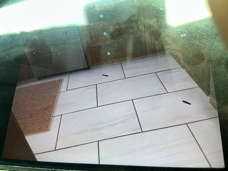 Responded to water leak repair request following third-party leak detection service identification. Conducted on-site assessment and documented affected areas, including subfloor access point with visible tile work and adjacent hardwood flooring in living space. Photographed leak location and surrounding damage for estimate preparation and provided customer with repair options for water line restoration.