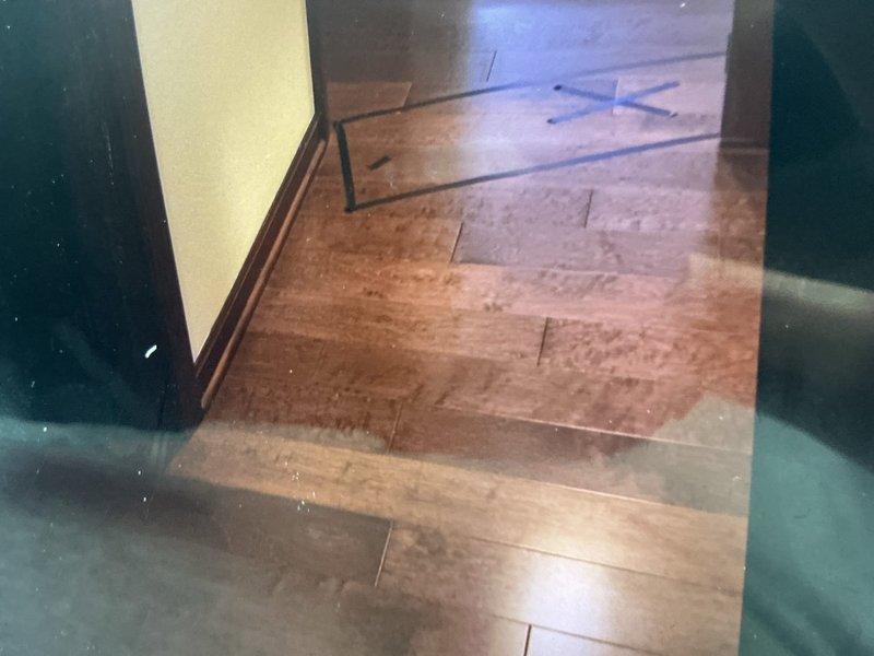 Responded to water leak repair request following third-party leak detection service identification. Conducted on-site assessment and documented affected areas, including subfloor access point with visible tile work and adjacent hardwood flooring in living space. Photographed leak location and surrounding damage for estimate preparation and provided customer with repair options for water line restoration.