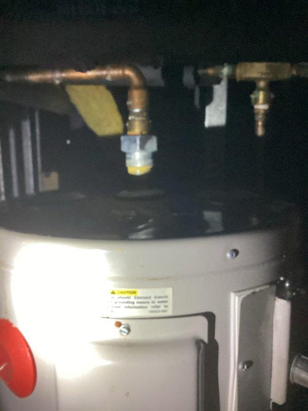 Responded to service call for commercial hot water heater assessment. Upon inspection, found existing 10-year-old tank-style water heater with severe corrosion and rust deterioration at the tank bottom and lower connection points. Documented extensive rust staining and compromised tank integrity indicating imminent failure. Photographed existing installation including copper supply piping, brass fittings, and current mounting configuration. Provided quote for complete water heater replacement due to non-repairable tank corrosion.