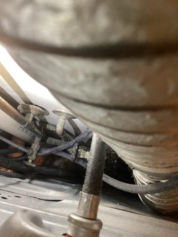 Responded to service call for broken drain line located approximately 20 feet from the structure, as confirmed by customer's camera inspection. Assessed the damaged drainage system and discussed comprehensive repiping options with the property owner. Evaluated the existing plumbing infrastructure, including water heater connections and main supply lines, to determine the scope of work required for a complete repipe solution. Provided consultation on the addition of an exterior cleanout access point to facilitate future maintenance and prevent similar drainage issues. Documented current system conditions through photographs showing water heater connections, flexible supply lines, and existing plumbing configuration to support repair recommendations.