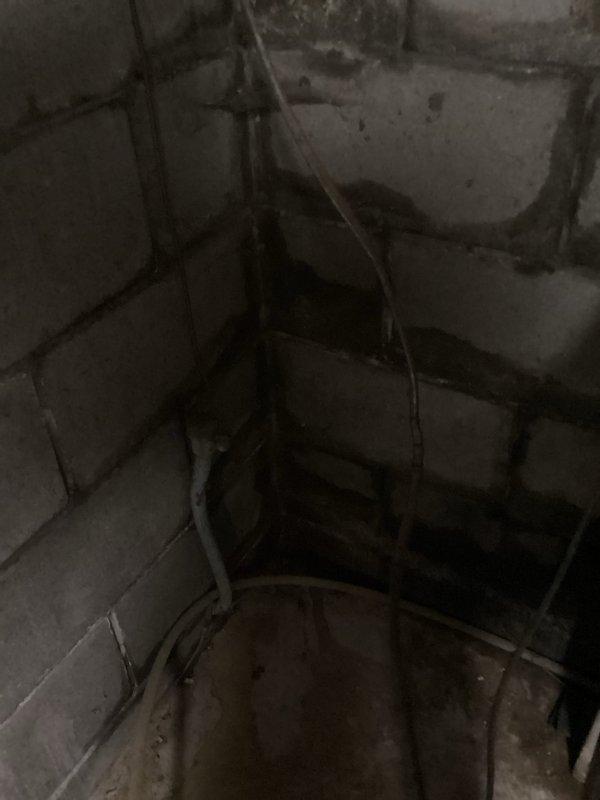 Responded to drainage issue where previous broken pipe repair had been completed, but water flow had created a trench causing basement water infiltration. Inspected basement mechanical area and plumbing system, including water treatment equipment, pressure tank, and associated piping. Assessed drainage patterns and water entry points to determine proper remediation approach for preventing further basement water intrusion from yard runoff.