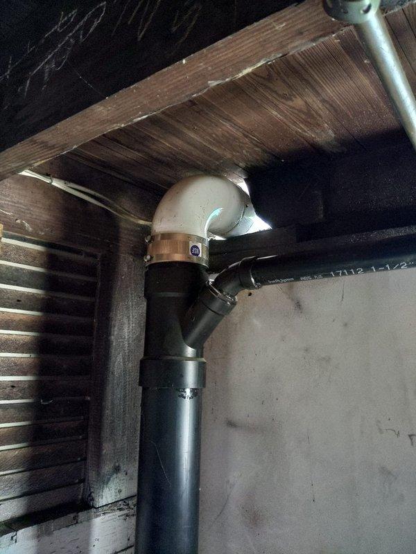 Replaced deteriorated cast iron stack from second floor to basement with 4" PVC pipe and fittings. Installation included proper drainage configuration with P-trap assembly in attic space and vertical drain line through floor joists to basement level. All connections secured to structural elements per code requirements, utilizing appropriate couplings and elbow fittings to ensure proper flow and venting.