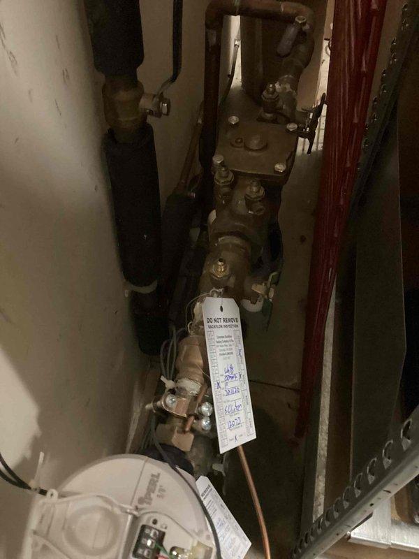 Completed annual backflow prevention testing on two Wilkins backflow devices per regulatory requirements. The irrigation system device (Serial No. 324937) and domestic water supply device (Serial No. 321620) were both inspected, tested, and documented with full photographic records including device identification and serial number verification. Both assemblies passed testing and are functioning within acceptable parameters. Test results have been filed with the local water purveyor and compliance documentation provided to facility management with complete device specifications, locations, and system protection classifications.