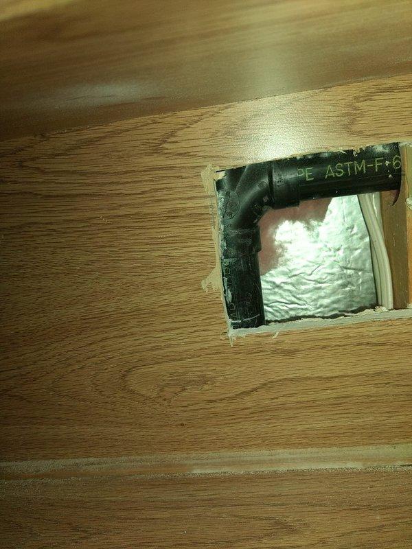 Responded to kitchen drainage leak complaint and accessed crawl space beneath kitchen area to inspect plumbing system. Located active leak at garbage disposal drain connection point. Removed damaged drain pipe section and replaced with new code-compliant drainage assembly. Secured all connections with proper fittings and verified watertight seal. Tested system under full water flow to confirm leak resolution and proper drainage function.