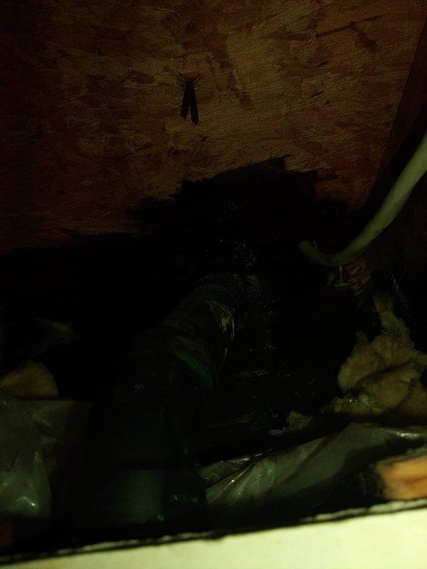 Responded to kitchen drainage leak complaint and accessed crawl space beneath kitchen area to inspect plumbing system. Located active leak at garbage disposal drain connection point. Removed damaged drain pipe section and replaced with new code-compliant drainage assembly. Secured all connections with proper fittings and verified watertight seal. Tested system under full water flow to confirm leak resolution and proper drainage function.