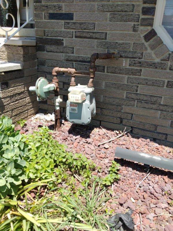 Installed 20 feet of gas piping from exterior tap location to service the garage area. Connected copper gas line to existing meter with appropriate shut-off valves and fittings, then routed piping through exterior wall into garage space. Obtained required permit through Summit County and completed installation per local code requirements.