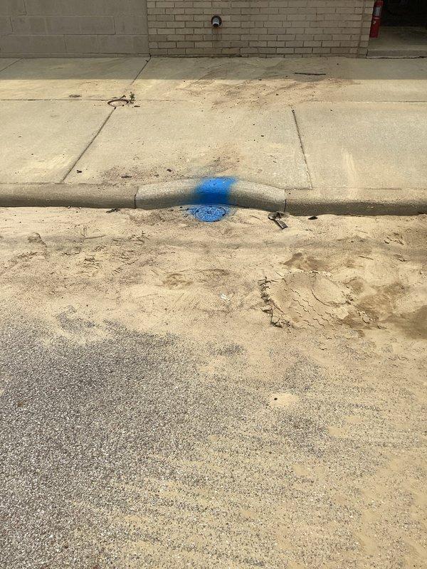 Responded to emergency water service call for suspected underground pipe failure with water supply shut off to property. Upon arrival, conducted thorough inspection of mechanical room and exterior utility areas to locate source of leak. Documented extensive water damage evidence in basement mechanical room, including significant mineral deposits and sediment accumulation on concrete floor near HVAC equipment, indicating prolonged water intrusion. Traced water supply lines and identified blue utility markings on exterior concrete near foundation, suggesting previous excavation work or known utility line location. Assessed damage patterns and determined underground pipe breach as likely cause based on water shutoff necessity and visible evidence. Captured photographic documentation of affected areas for insurance and repair planning purposes. Recommended excavation and pipe replacement services to address underground leak source.