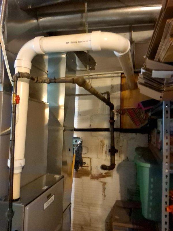Installed 30 feet of 1-inch gas piping from an interior 1.5-inch supply tap to service HVAC equipment, including furnace and outdoor air conditioning condenser unit. Routed gas line through basement utility area and exterior wall to green gas meter mounted on building exterior, ensuring proper connection to all appliances and compliance with permit requirements for Summit County.