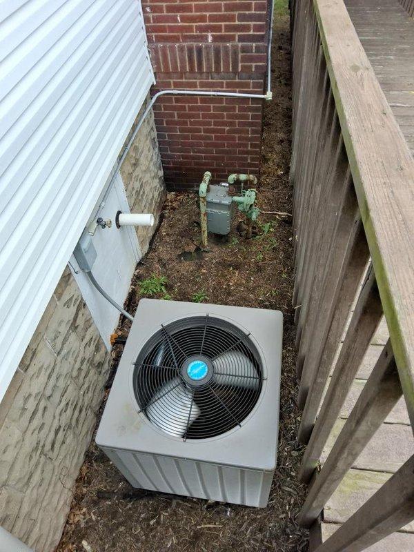 Installed 30 feet of 1-inch gas piping from an interior 1.5-inch supply tap to service HVAC equipment, including furnace and outdoor air conditioning condenser unit. Routed gas line through basement utility area and exterior wall to green gas meter mounted on building exterior, ensuring proper connection to all appliances and compliance with permit requirements for Summit County.