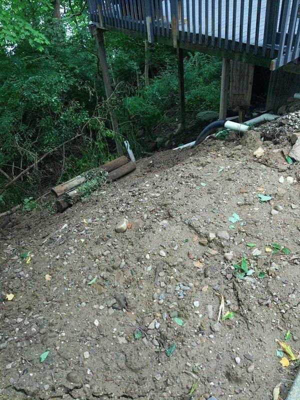 Responded to service call for sewer line repair connected to grinder pump system. Upon inspection, identified damaged sewer line requiring repair work in exterior hillside area beneath elevated deck structure. Assessed drainage and plumbing components, documented existing conditions with photos showing exposed PVC piping and gravel terrain, and confirmed repair requirements for proper connection to grinder pump system.